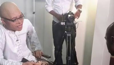 Photo: Anas removes mask for an interview with BBC