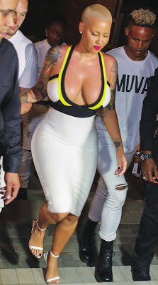 Photos: Amber Rose squeezes giant curves in a body-fitting dress as she parties in the Caribbean