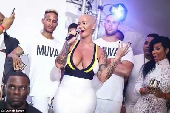 Photos: Amber Rose squeezes giant curves in a body-fitting dress as she parties in the Caribbean